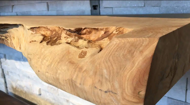 Live edge fireplace mantel installation in Vancouver home