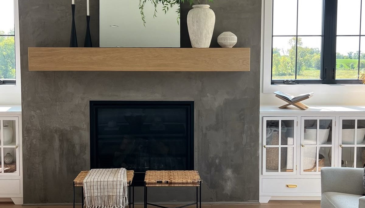 Sleek concrete fireplace surround with wood accents