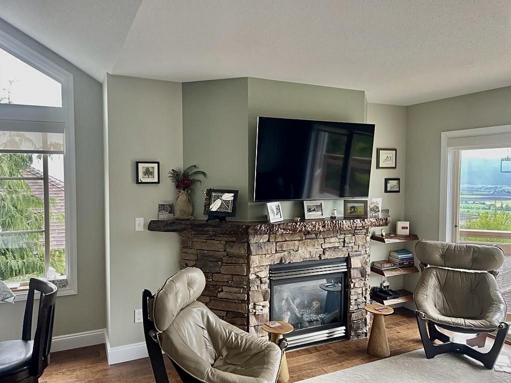 Full fireplace mantel surround with stone framing in Burnaby